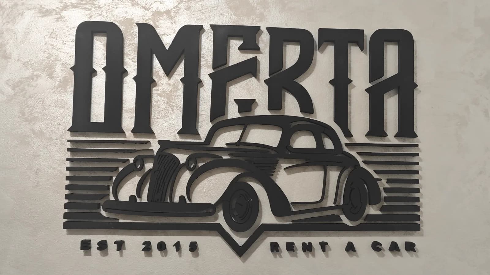 Logo od stirodura za Omerta Rent a Car